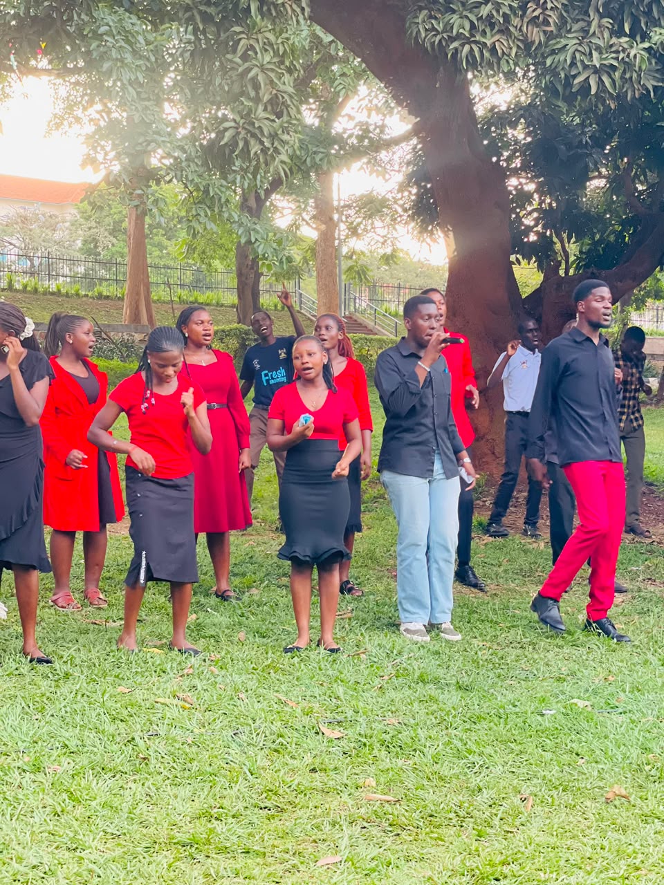 Fellowship members singing together outdoors