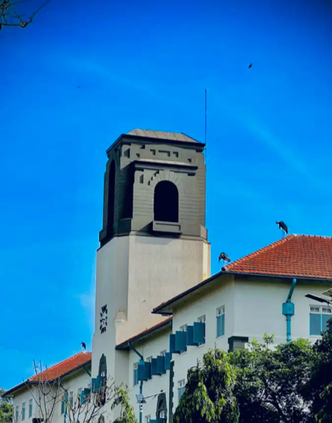 Makerere University Main Building clock tower under a clear sky